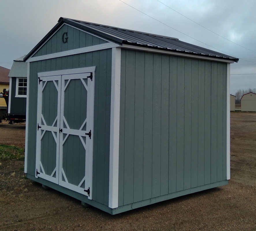 10x12 Utility with Green Metal Roof and Douglas Fir Siding Stained Honeygold